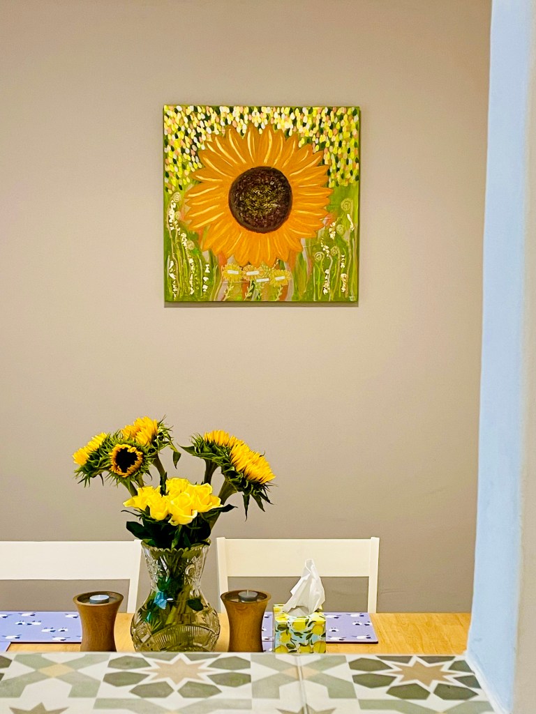 Photo of the sunflower artwork in the designated space with complimenting colour scheme